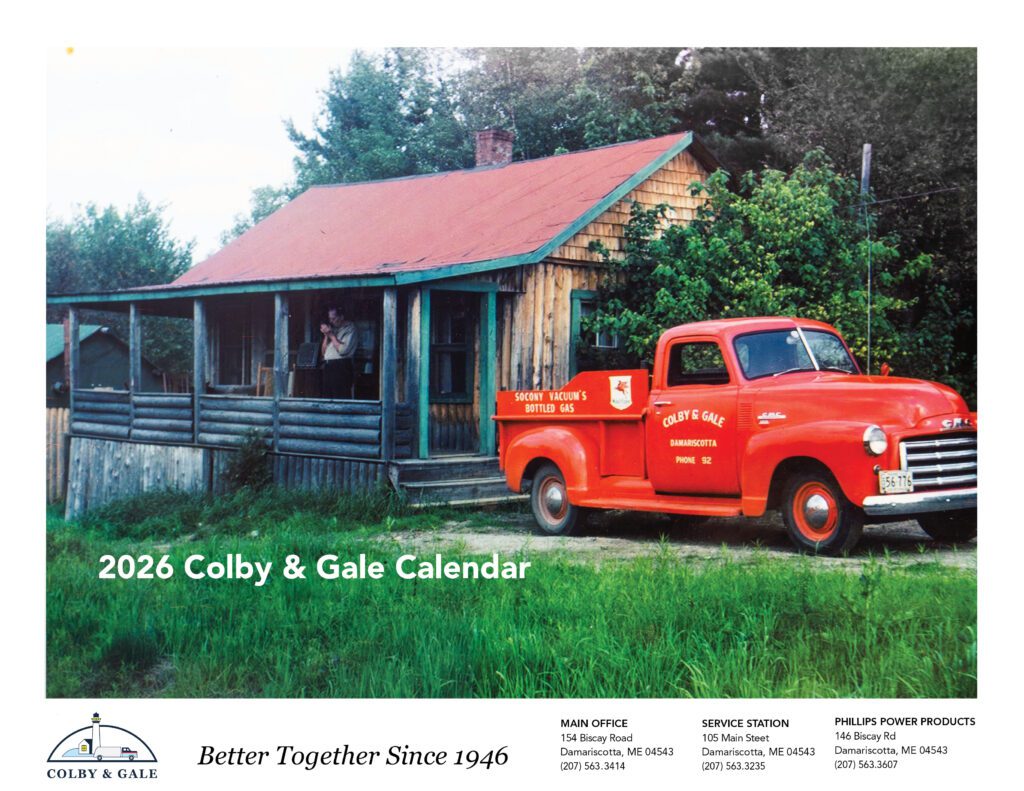 Photo of man smoking on porch with red old school Colby & Gale parked in driveway. 