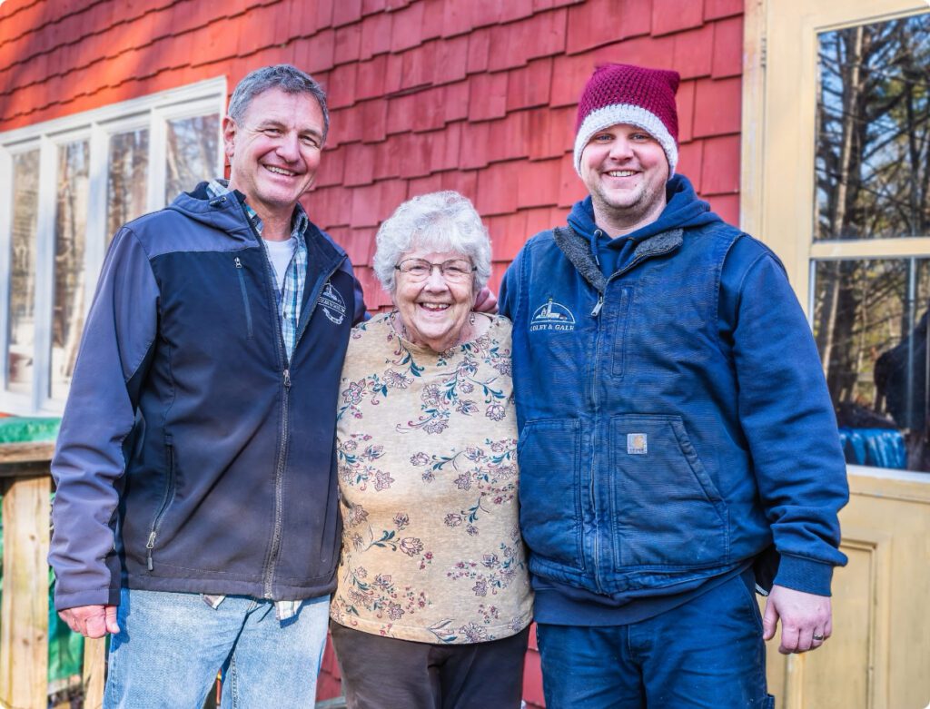 Cappy and Nick posing with customer outside.