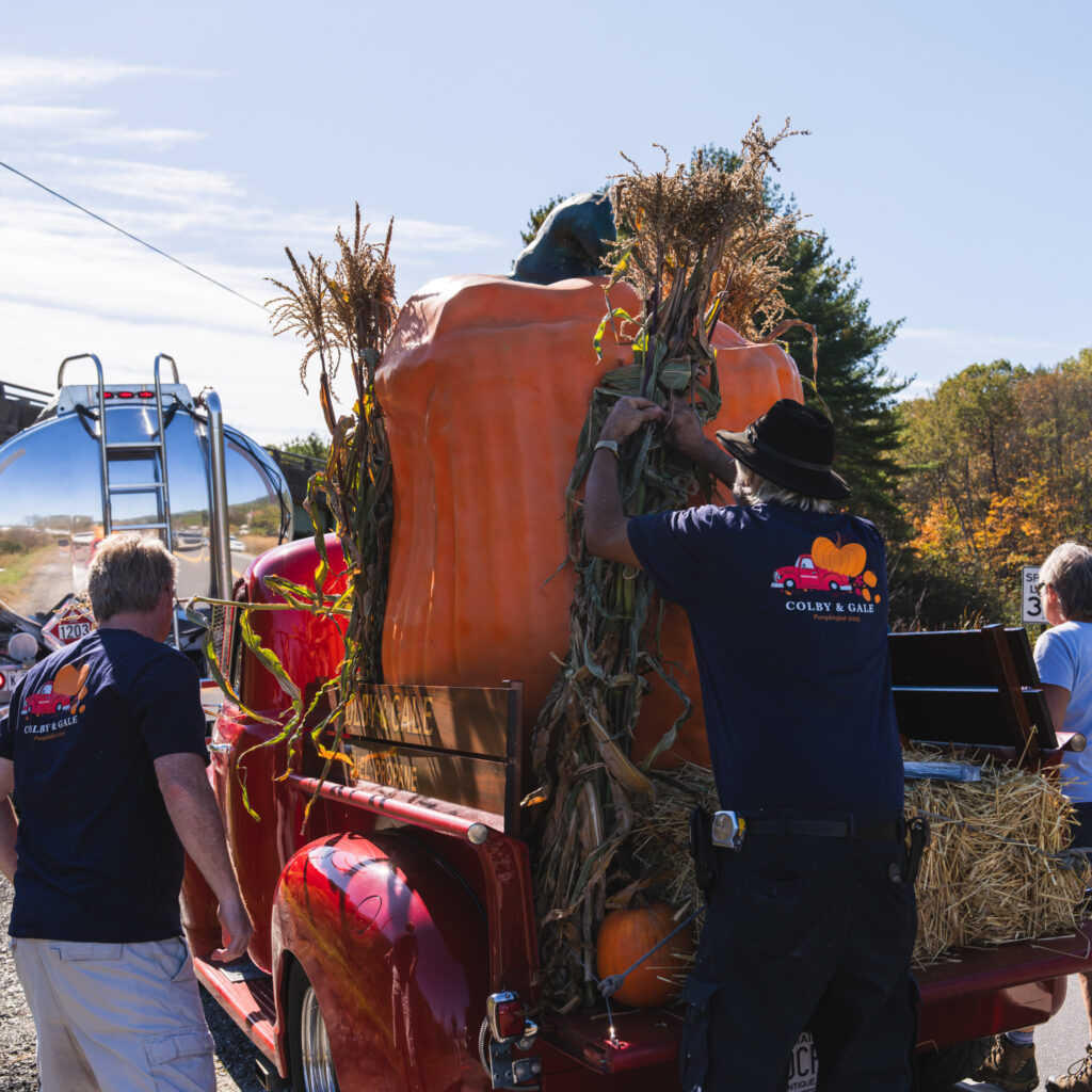 Mike Morrison and Shawn Leeman prepping car for Pumpkinfest Parade