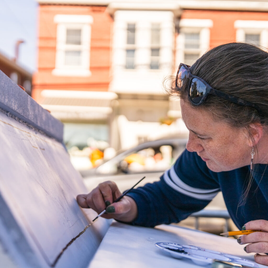 Kristen Dighton painting Colby & Gale pumpkin