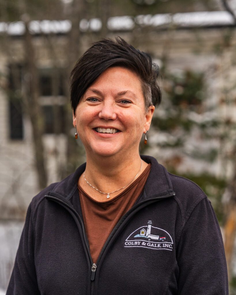 Trudy Gamage smiling wearing a black Colby & Gale branded L.L. Bean Jacket