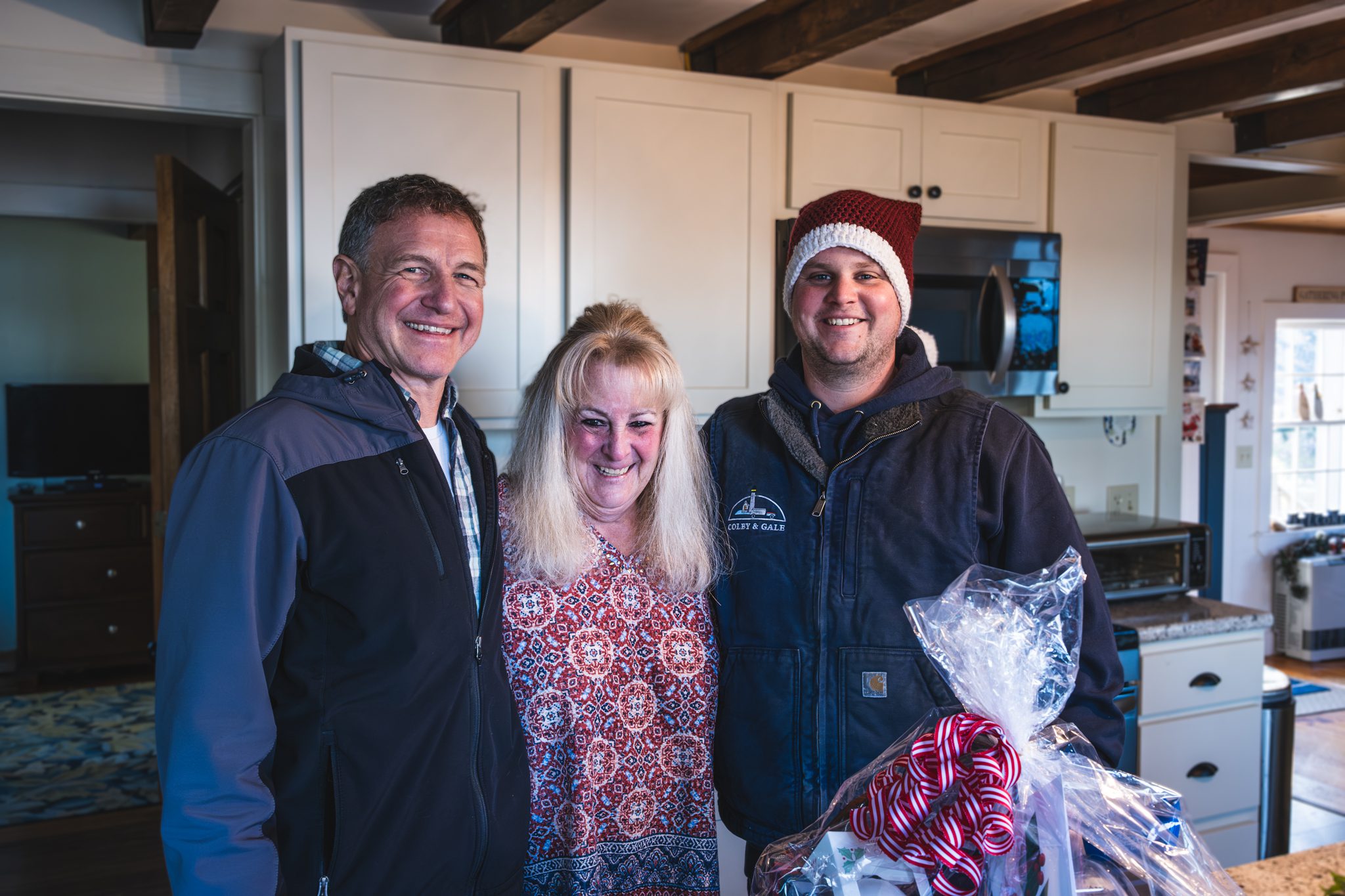 Cappy and Nick posing with customer smiling.